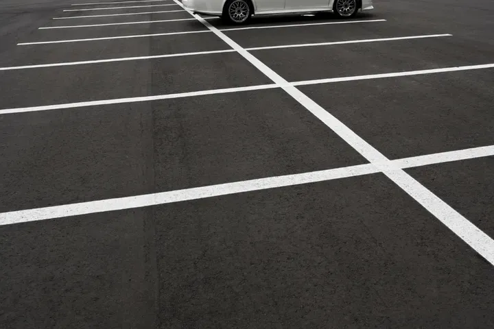 Parking lot paving with a marked drive aisle